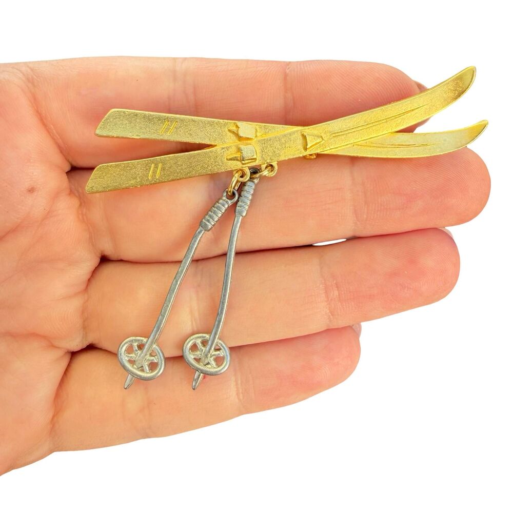 Vintage detailed metal Brooch by M.Jent gold colored skis and silver colored ski